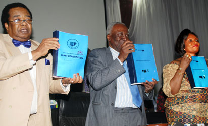 L-r: Deputy Chairman, National Conference, Prof. Bola Akinyemi, Chairman of the Conference, Justice Idris Kutigi(rtd) and the Secretary National Conference, Prof.Valerie Azinge, displaying the Conference Report, yesterday, at the National Conference in Abuja.