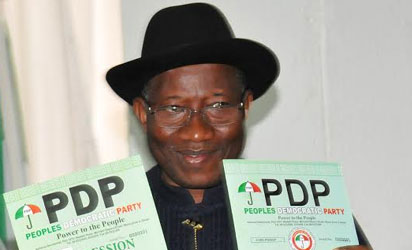 President Goodluck Jonathan displaying Expression of Interest and Nomination Forms  at the People's Democratic Party's Secretariat in Abuja on Thursday (30/10/14). 