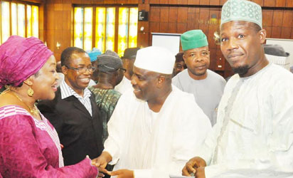 Speaker Aminu Tambuwal (m) With others during an emergency plenary In Abuja on Thursday (20/11/14).
