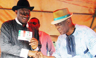 PRESIDENT AT THE PDP WARD CONGRESS -7 , PRESIDENT GOODLKUCK JONATHAN (LEFT) RECEIVING HIS NEW PDP MEMBERSHIP CARD FROM PDP STATE CHAIRMAN , COLONEL (RTD) SAM INOKOBA AT THE OTUABULA 11 , WARD 13 PDP WARD CONTRESS IN OGBIA LOCAL GOVERNMENT OF BAYELSA STATE SATURDAY