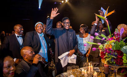 DINNER—President Muhammadu Buhari waves to other guests as he is recognized amongst other Heads of States at a dinner which took place, yesterday, at the International Conference Centre in Johannesburg South Africa during 25th AU Summit
