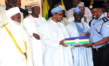  I-G SOLOMON ARASE (2ND R), PRESENTING A SOUVENIR TO PRESIDENT  MUHAMMADU BUHARI (4TH-L), DURING THE NATIONAL SECURITY SUMMIT 2015 IN  ABUJA ON MONDAY (17/8/15).WITH THEM ARE  GOV. DANKWANBO IBRAHIM OF GOMBE,  (3RD R),SULTAN OF SOKOTO, MUHAMMADU SA'AD ABUBAKAR III  (L), FORMER  INSPECTOR GENERAL OF POLICE, MR SUNDAY ADEWUSI (R) AND OTHERS  