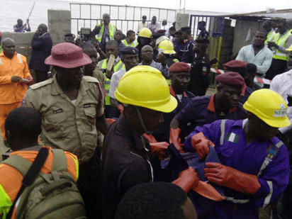 Rescuers at the scene of the crash in Lagos