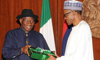 Former President, Dr Goodluck Jonathan handing over reports of the 2014 National Conference to President Muhammadu Buhari