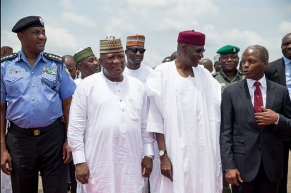 Buhari exchanges pleasantries from government officials as he arrives Abuja from the 70th UN General Assembly in New York, USA, on Wednesday