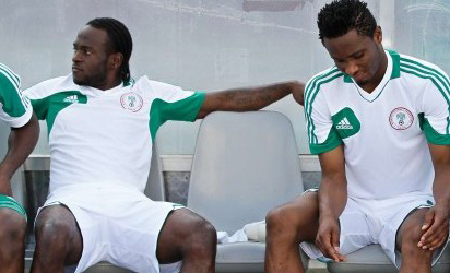 GETTING READY ... Super Eagles duo, Victor Moses (l) and Obi Mikel on reserve bench in readiness for action.