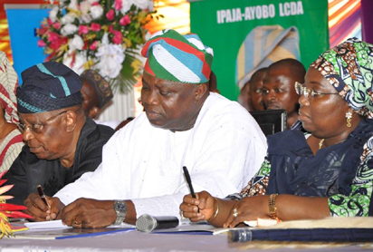 Governor Akinwunmi Ambode (m); his Deputy, Dr (Mrs) Idiat Adebule (right) taking notes during Ambode's First Quarterly Town Hall Meeting, themed, “Community Inclusion in Governance,” held at the Abesan Mini Stadium, Ayobo-Ipaja, Lagos on Tuesday, October 6, 2015