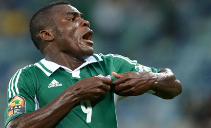 A file picture taken on February 6, 2013 shows Nigeria's forward Emmanuel Emenike celebrating after scoring a goal during the 2013 African Cup of Nations semi-final football match Mali vs Nigeria in Durban. Nigeria striker Emmanuel Emenike on October 20, 2015 announced his retirement from international football, after a barren spell in front of goal.    AFP PHOTO