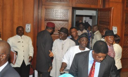 WALK-OUT—PDP Senators, led by Senate Minority Leader and ex-Akwa Ibom governor, Godswill Akpabio (left), walking out of the Senate Chamber to register their opposition to confirmation of ex-Governor Rotimi Amaechi as minister by the Senate, yesterday. Photo: Gbemiga Olamikan.