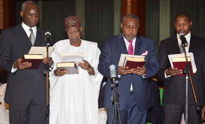 MINISTERS 6 L-R; New Ministers, Mr. Babatunde Fashola (Power, Works and Housing); Lai Mohammed(Information); James Ocholi, (State, Labour and Employment); and Alh. Abubakar Malami (Justice) taking the oath of Office as Federal Ministers during their swear-in ceremony, held at the Presidential Villa Abuja. Photo by Abayomi Adeshida 11/11/2015