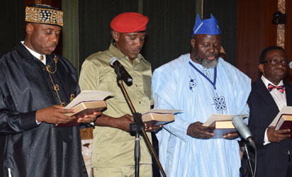 MINISTERS 8 L-R; New Ministers Rotimi Amaechi (Transportation); Solomon Dalong ( Youth & Sports); Barrister Adebayo Shittu (Communications); Prof. Isaac Folorunso Adewole (Health); taking the oath of Office as Federal Ministers during their swear-in ceremony, held at the Presidential Villa Abuja. Photo by Abayomi Adeshida 11/11/2015
