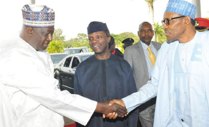 SECRETARY TO THE GOVERNMENT OF THE FEDERATION, MR DAVID LAWAL (L) WELCOMING PRESIDENT MUHAMMADU BUHARI TO THE PRESIDENTIAL RETREAT FOR MINISTERIAL-DESIGNATES AT THE PRESIDENTIAL VILLA IN ABUJA ON THURSDAY (05/11/15). WITH THEM IS THE VICE PRESIDENT YEMI OSINBAJO.
