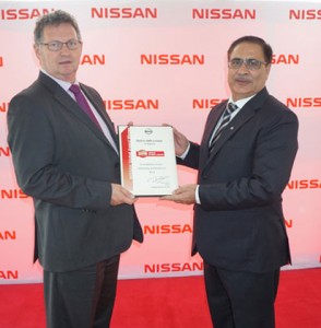 Mike Whitefield (l), Managing Director and President, Nissan South Africa presents a commemorative Nissan Global NSC certificate to Pavir Singh, Managing Director, Stallion NMN at a banquet in Lagos where the Nissan achievement award was presented to the company for outstanding performance in 2014 sales year