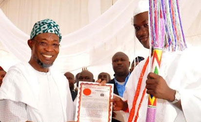 GOV. RAUF AREGBESOLA OF OSUN STATE(L) PRESENTING STAFF OF OFFICE TO THE OONI OF IFE, OBA ADEYEYE ENITAN OGUNWUSI, AT EMUWA PALACE SQUARE ILE IFE ON MONDAY( 7/12/15).