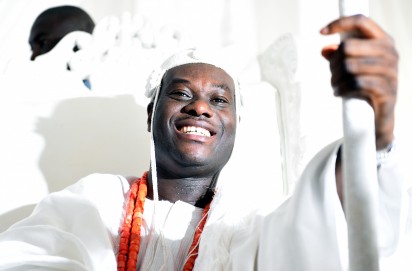 The new Ooni of Ife, Oba Adeyeye Enitan Ogunwusi sits for his coronation at Ile-Ife in southwest Nigeria, on December 7, 2015.  41-year-old multi-millionaire Adeyeye Enitan Ogunwusi, has been officially installed as the new Ooni of Ife. The monarch is the spiritual leader and the most influential traditional monarch among the Yoruba people of Nigeria's southwest .AFP 