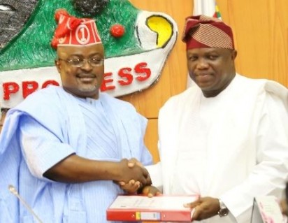Lagos State Governor, Mr. Akinwunmi Ambode (right), presenting the 2016 Budget to the Speaker, Lagos House of Assembly, Rt. Hon. Mudashiru Obasa