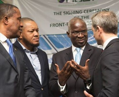 Hon. Minister of Power, Works & Housing, Mr Babatunde Fashola (2nd right), SAN shortly after the signing ceremony of Solar Power purchase agreement between National Bulk Electricity Trader(NBET) and Fourteen Solar Power Developer at the Transmission Company of Nigeria, (TCN), Maitama,FCT, Abuja on Thursday 21, July 2016.