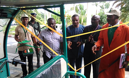 From left: Hon. Commissioner of Environment, Hon. Iniobong Ene Essien, CEO Arthur Energy Technology (AET) Ltd, Engr. Arthur Okeyika, Director public affairs AET Ltd, comrade Princewill  Okorie at the ribbon cutting ceremony  of Nigeria’s first solar powered Tricycle. 1st Akwa Ibom climate change and energy summit