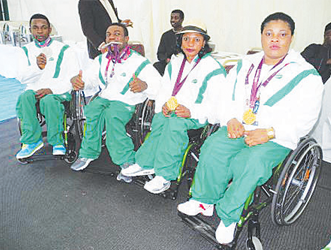 READY TO GO . . . Nigeria’s Paralympic athletes show off their medals after the London Games reception. They look set to win more medals in Rio 2016.