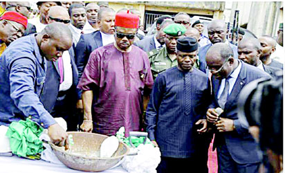 VP Osinbajo (2nd right), Gov. Obiano (3rd  right) and M/D Eastern Distilleries, Oranu Chidume, watch as government official mix cement for the laying of foundation stone of Eastern Distilleries Ltd in Onitsha