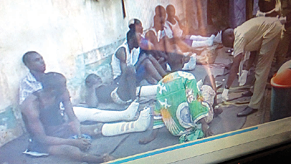 •Left: Some of the injured prisoners; right: smashed door of the prison