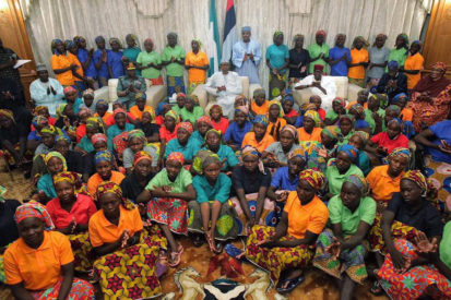 82 Chibok girls with President Buhari shortly before leaving for London