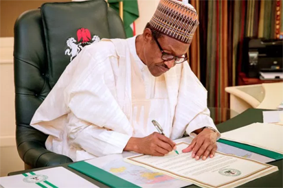 Image result for Corruption: Buhari signs executive order on suspicious assets