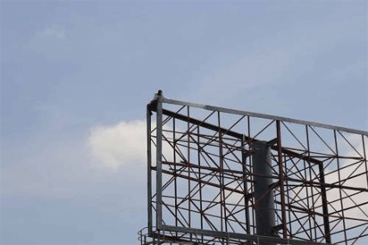 billboard man Breaking: Angry man climbs billboard hanger, vows not to come down till Atiku shows up