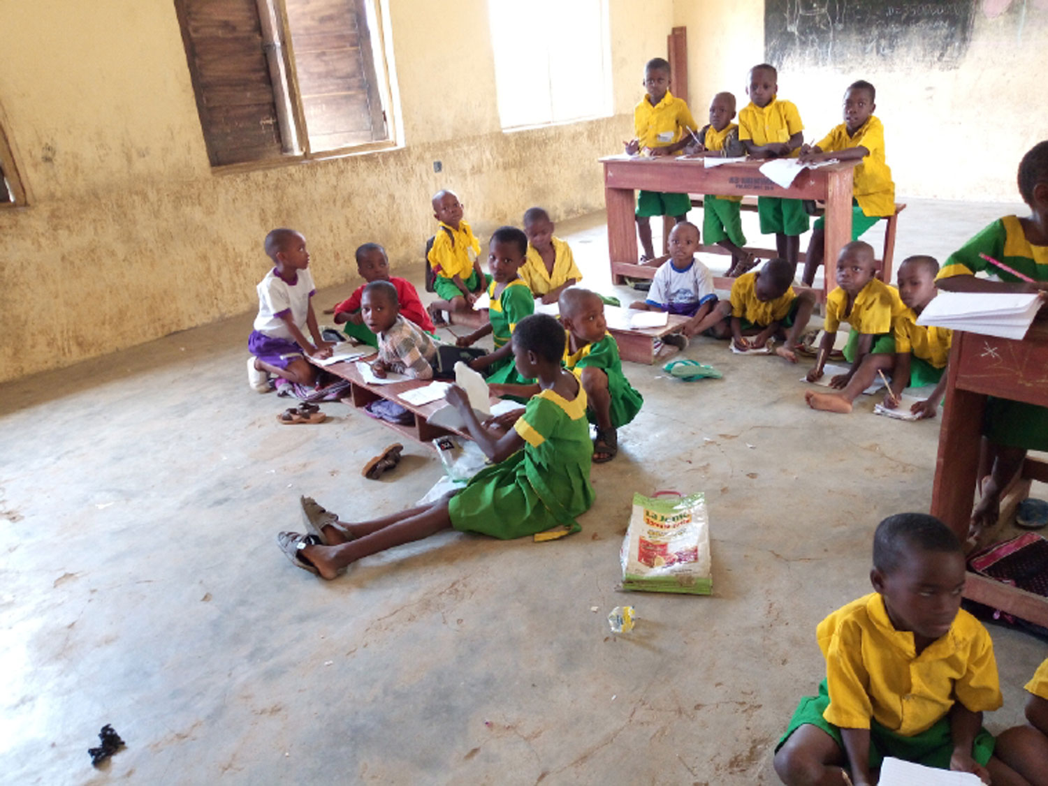 Pupils of Primary School, Nsukara Offot Uyo, sitting on the floor