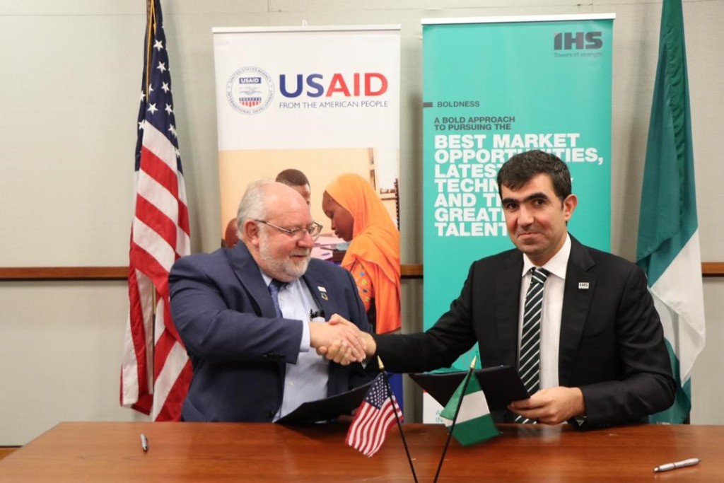 USAID Mission Director, Stephen M. Haykin; IHS Nigeria CEO, Mohamad Darwish at a signing event to announce IHS Nigeria’s support for USAID’s HIV/AIDS Eradication Efforts in commemoration of World AIDS Day.