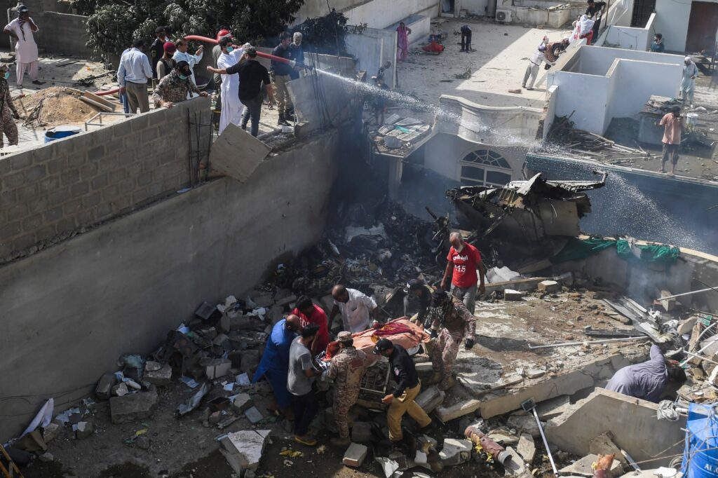 At least two survivors pulled from Pakistani airliner crash wreckage