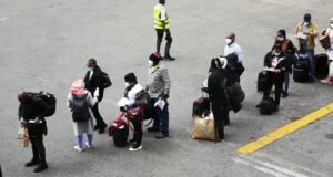 The Nigerians evacuated from UK on arrival at the MMIA, Lagos. PHOTO: Lamidi Morufu Bamidele