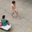 Man wears face mask as G-string, parades London street