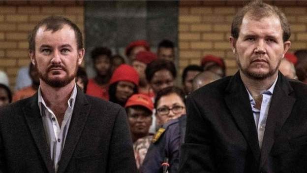 Two white South African farmers convicted of murdering a black teenager who they accused of stealing sunflowers worth $5 (£3) have had their sentences overturned and are now free.